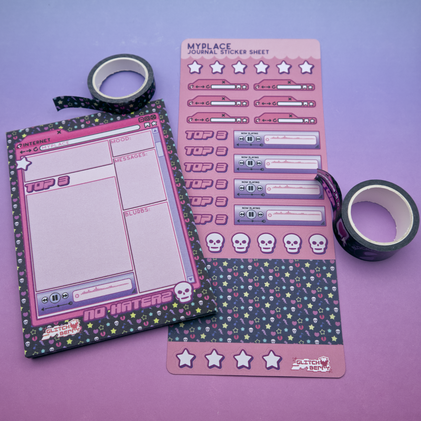 Pink emo-themed sticker sheet, memo pad, and decorative tape on a purple background