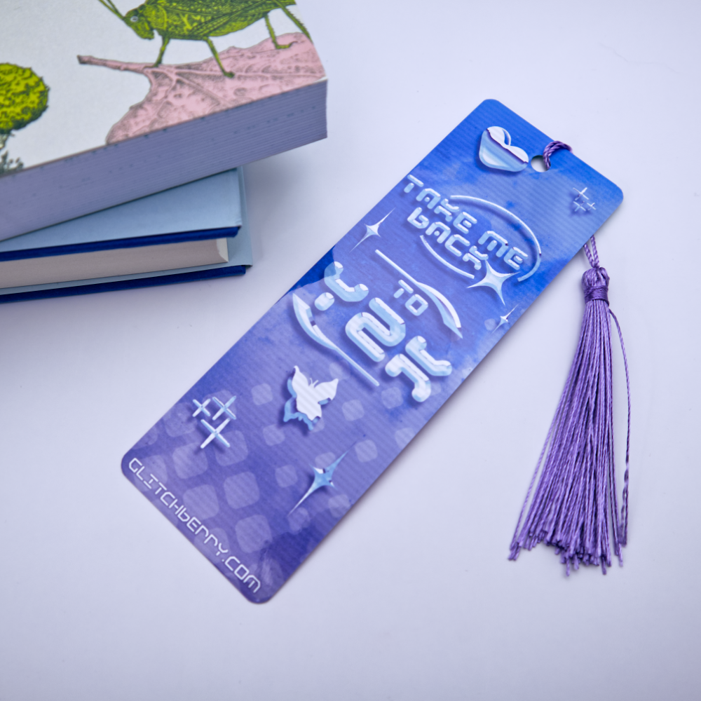Blue bookmark with with the text "Take me back ty Y2k" and a tassel on a light gray background