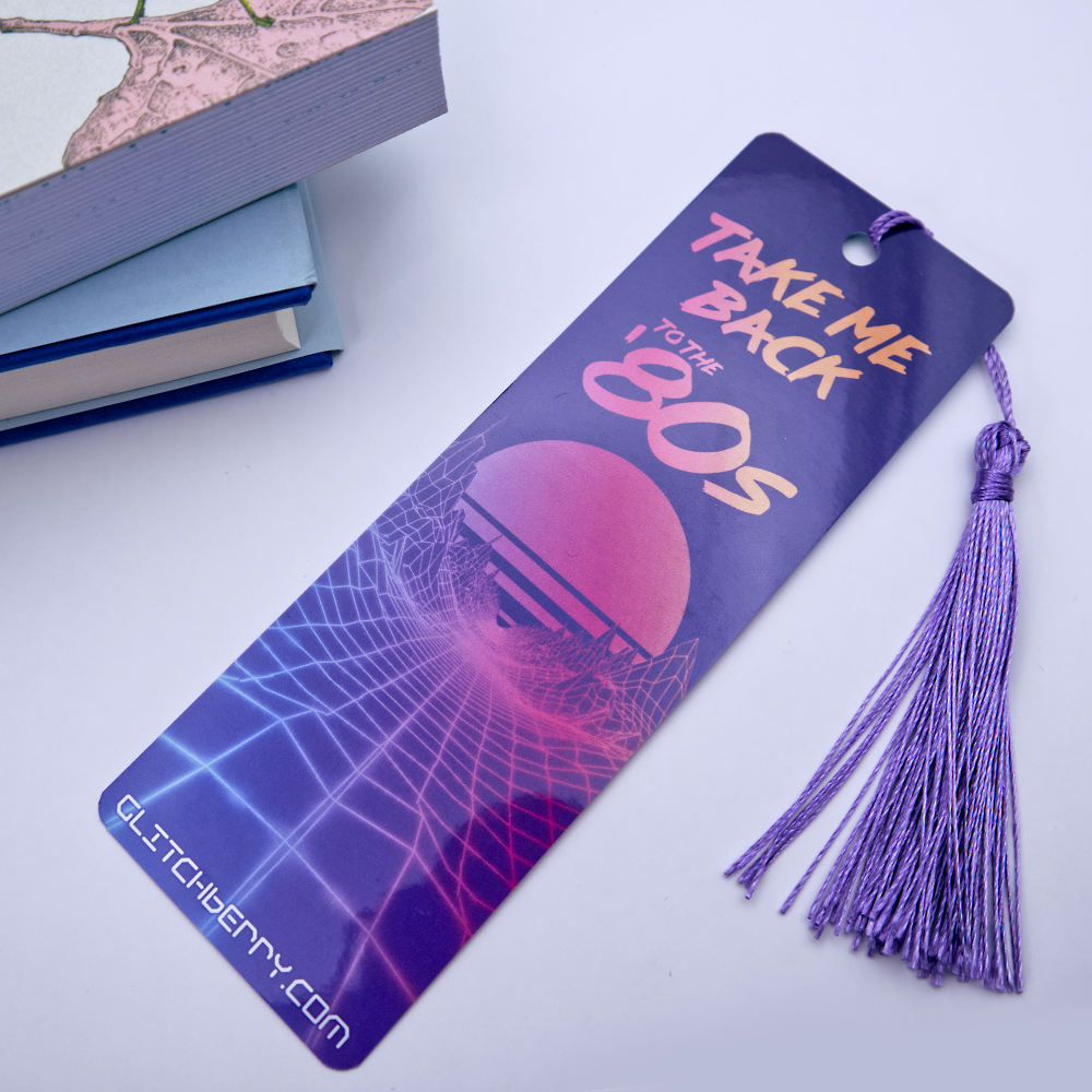 Bookmark with 'Take Me Back to the 80s' design and tassel on a white background