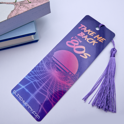Bookmark with 'Take Me Back to the 80s' design and tassel on a white background