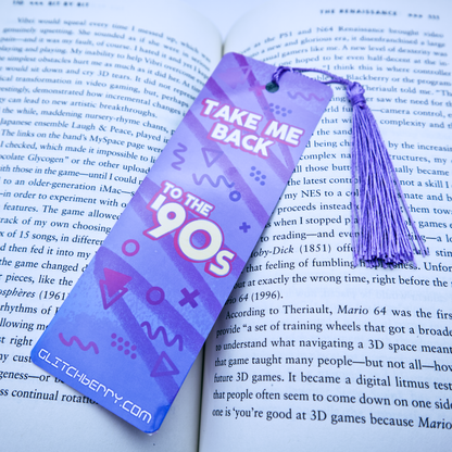Purple bookmark with 'Take Me Back to the 90s' text on an open book