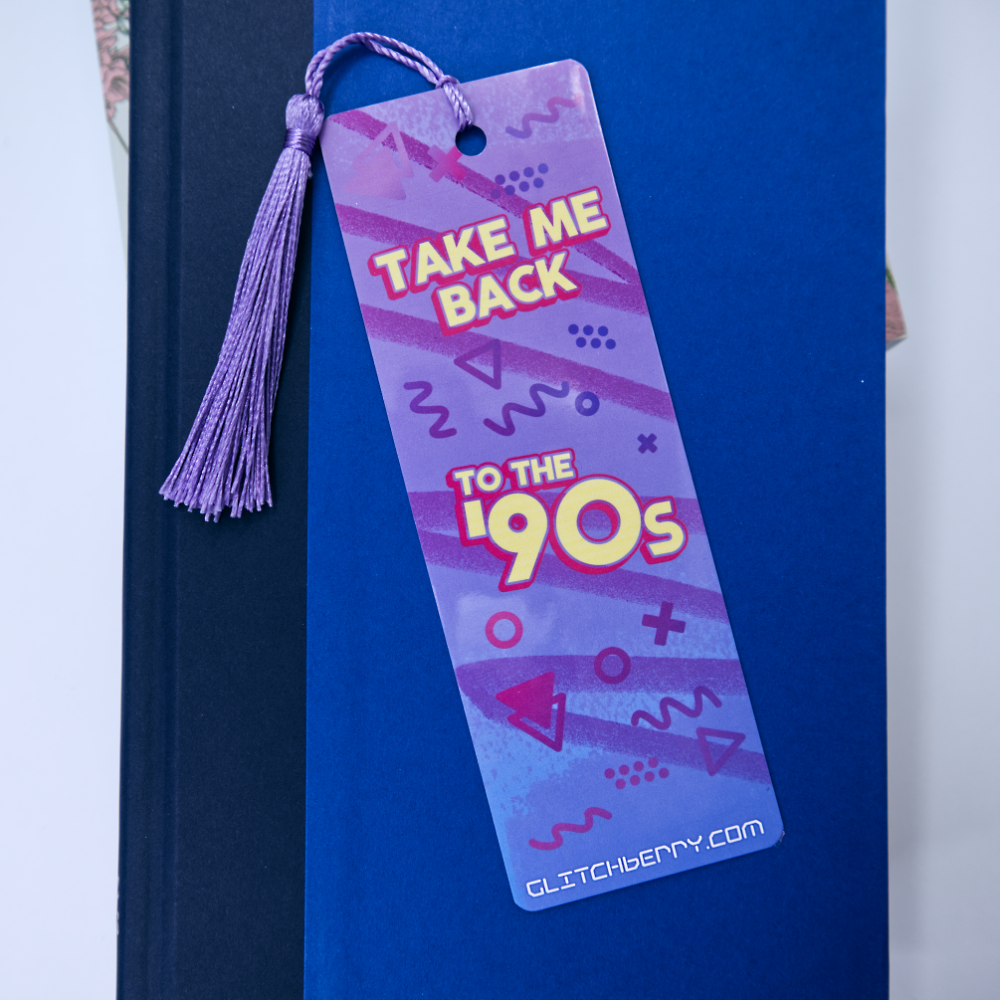 Bookmark with 'Take Me Back to the 90s' text and tassel on a blue background