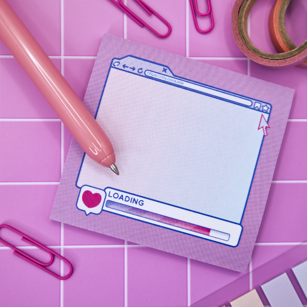 Pink sticky note pad with an internet browser loading screen design on a pink grid background with stationery items.