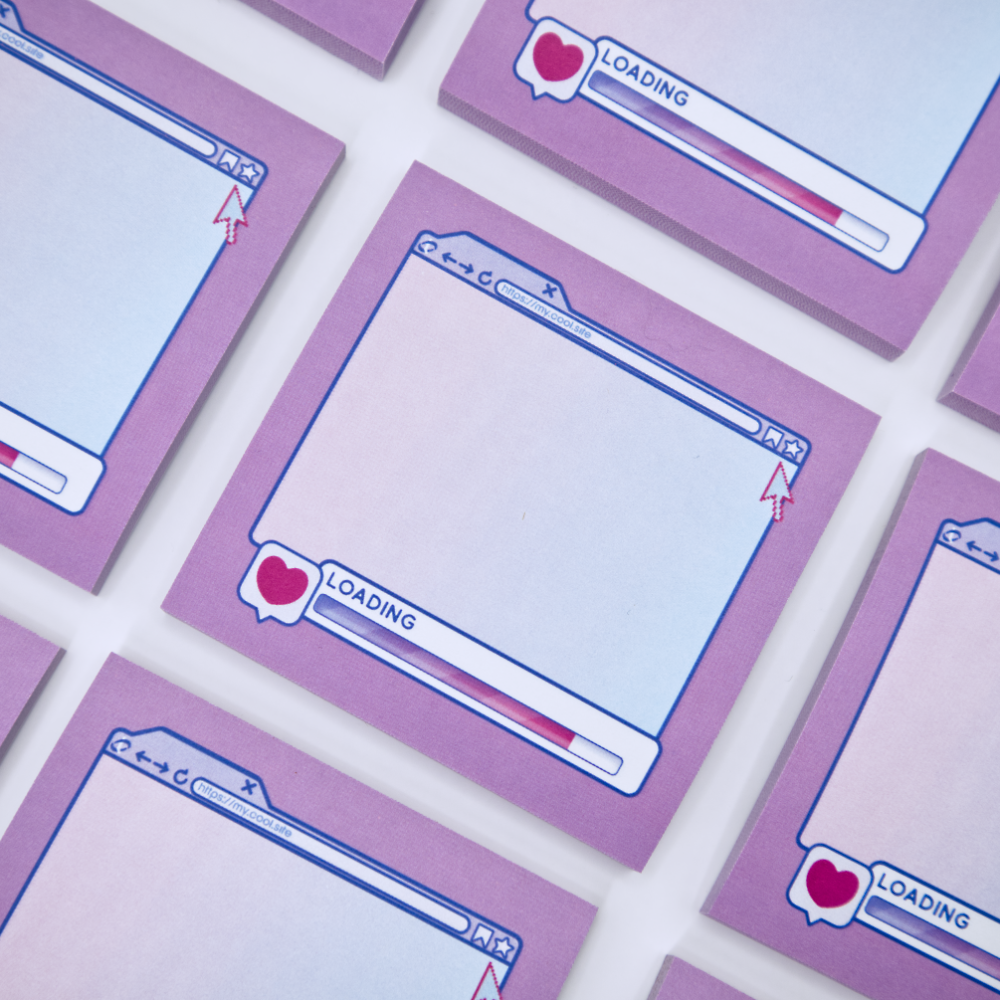 Pink sticky note pads with an internet browser loading screen design on a white background with stationery items.
