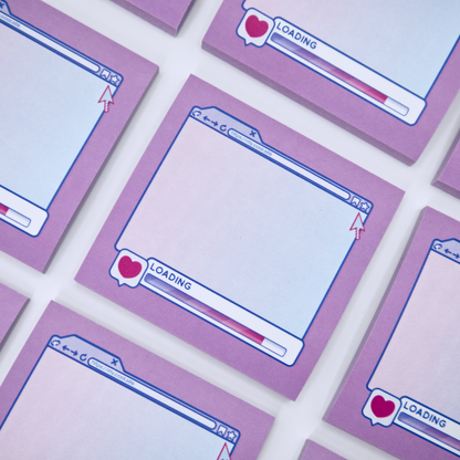 Pink sticky note pads with an internet browser loading screen design on a white background with stationery items.