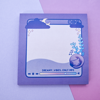 Purple sticky note pad with music player design featuring a cat and a plant on a pink and purple background