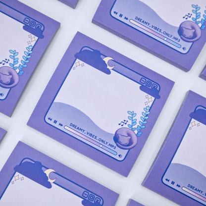Purple sticky note pads with music player design featuring a cat and a plant on a white background