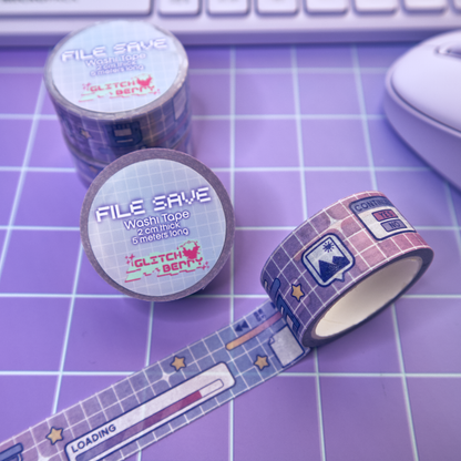 Rolls of washi tape with a celestial computer-themed design on a purple grid surface.