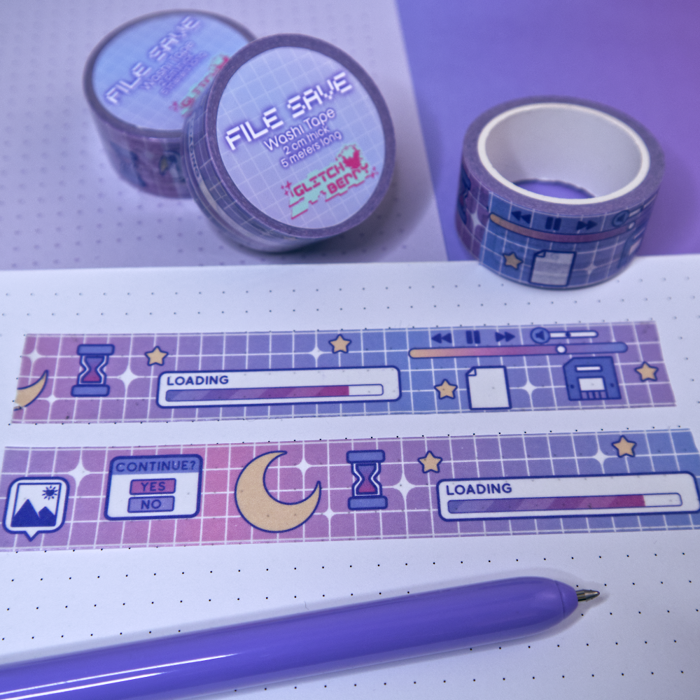 Decorative tape with a celestial computer-themed design on a white surface with a purple pen.