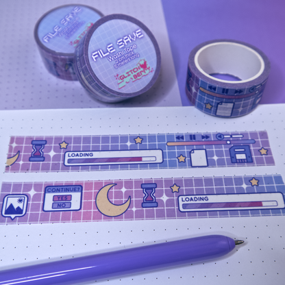Decorative tape with a celestial computer-themed design on a white surface with a purple pen.