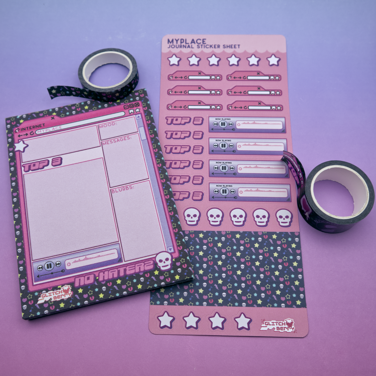 Pink emo-themed sticker sheet, memo pad, and decorative tape on a purple background
