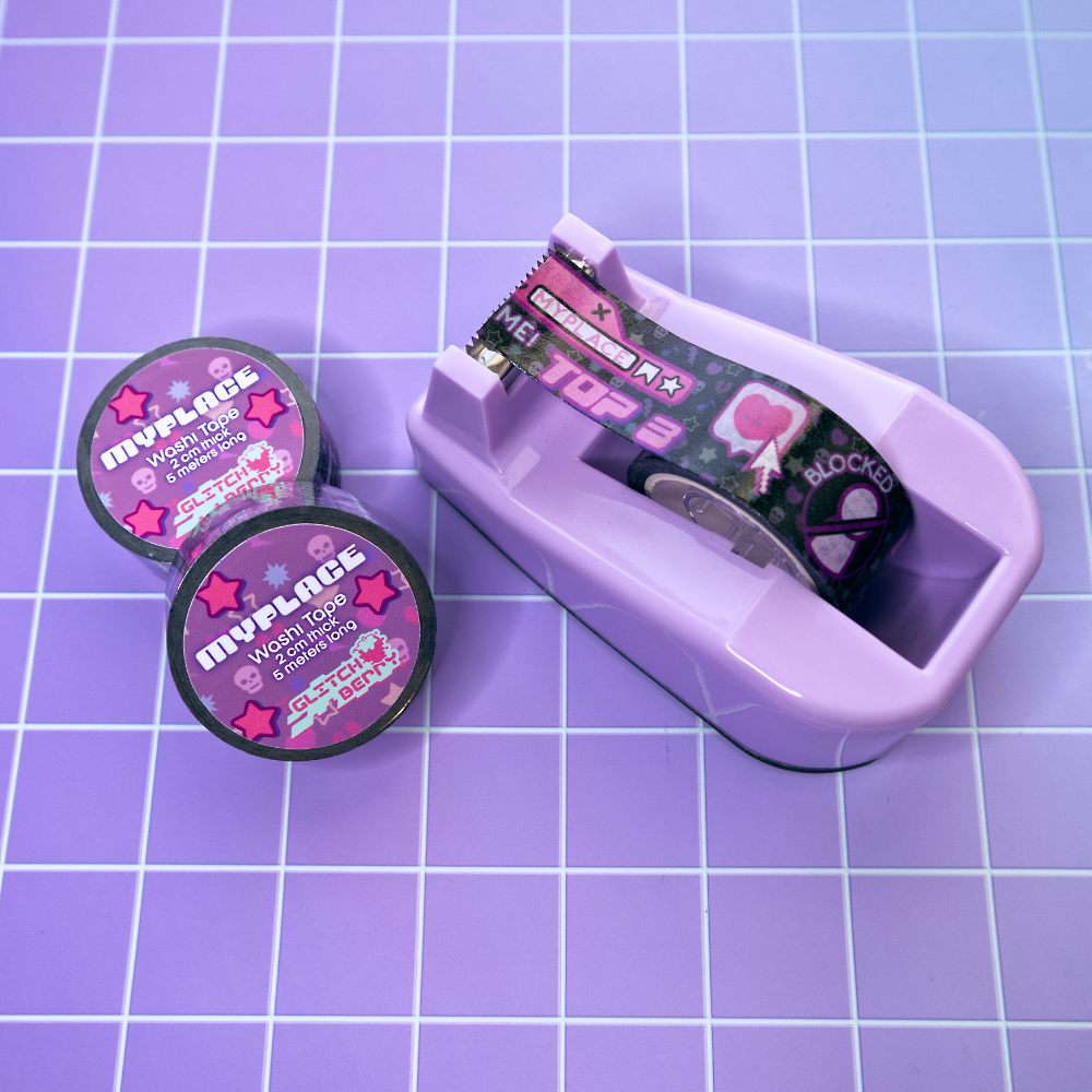 Purple tape dispenser with a roll of black emo-theme patterned washi tape with decorative designs reminiscent of early social profile pages on a purple grid background