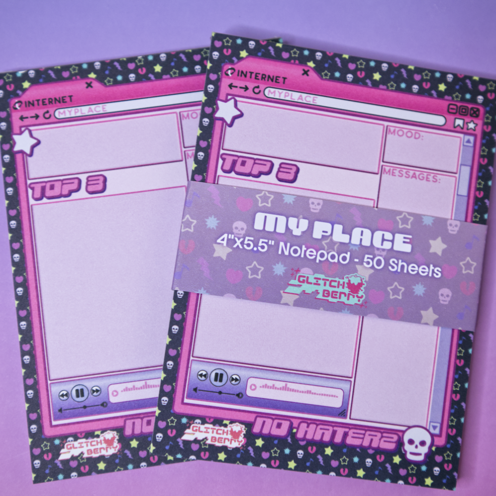 Notepad with a pink emo-themed design on a purple background