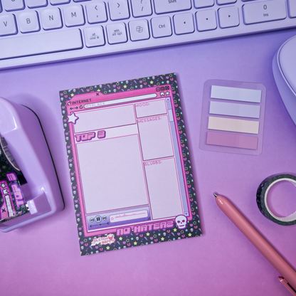 Pink emo-themed notepad with stationery items like matching washi tape, near a keyboard on a purple background