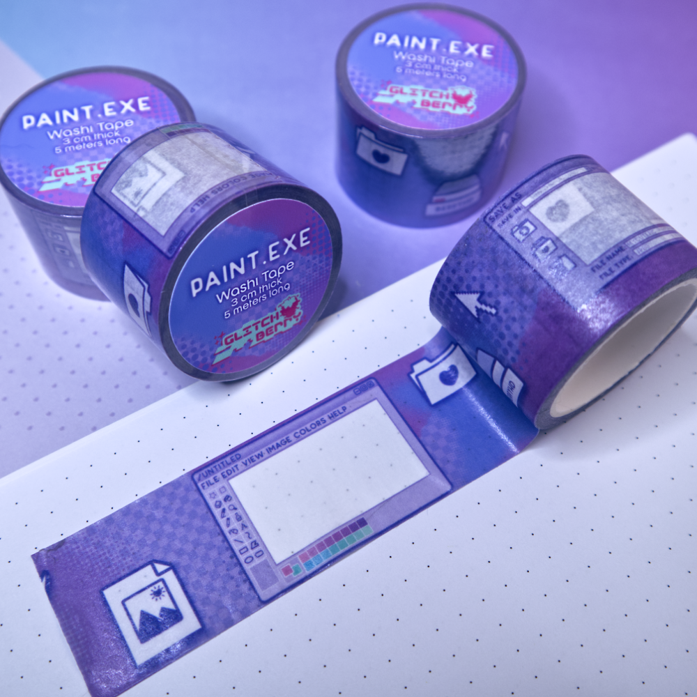 Roll of purple tape with digital paint program designs on a white surface.