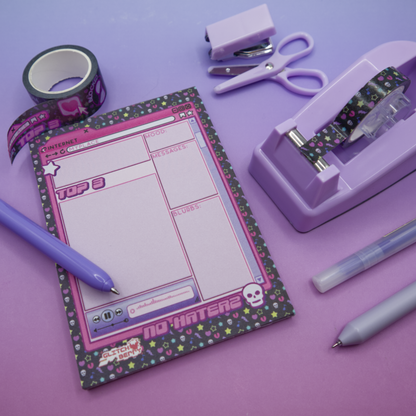 Pink emo-themed notepad with stationery items like matching washi tape on a purple background